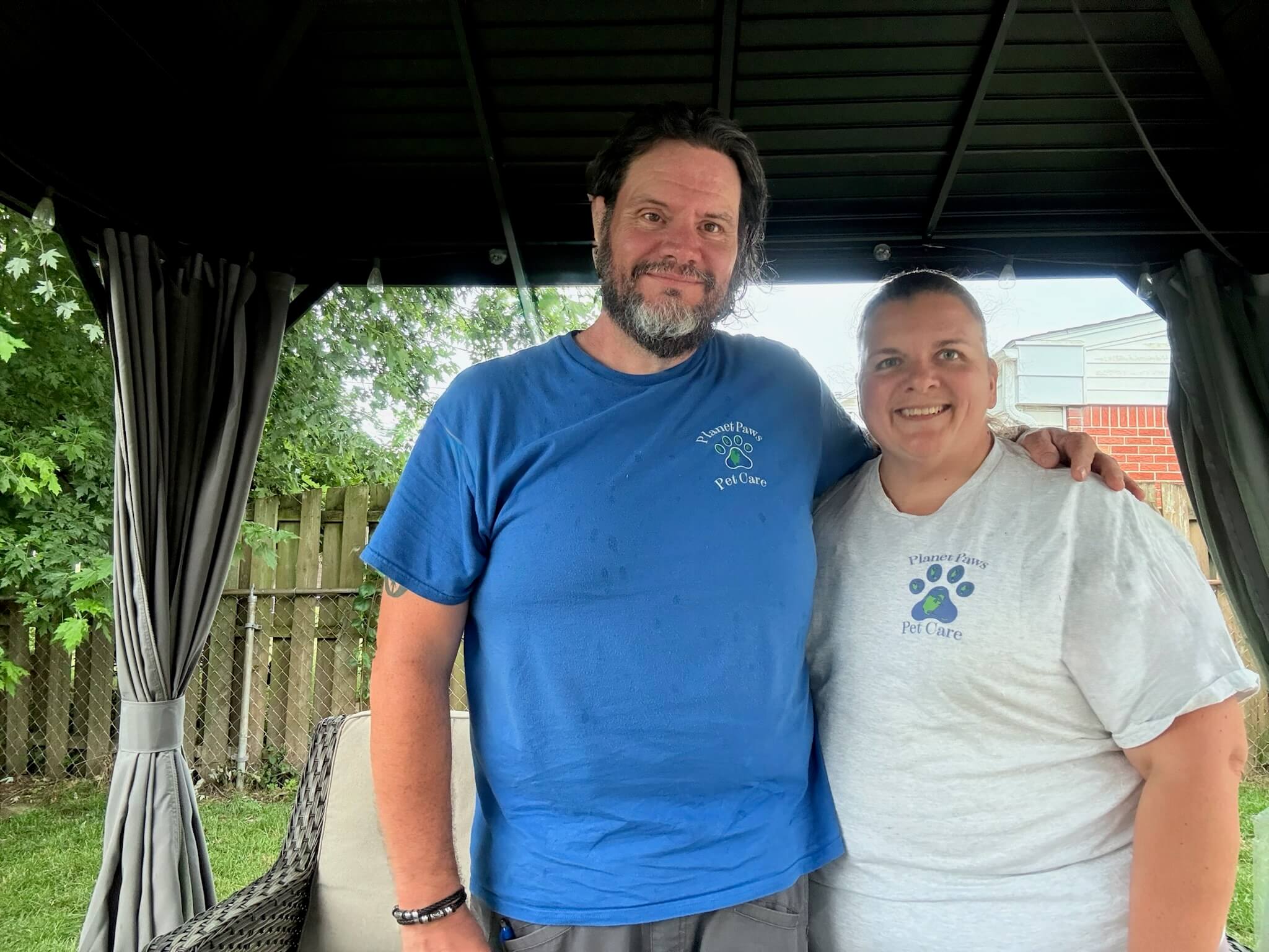 Kevin and his wife in Planet Paws Pet Care shirts